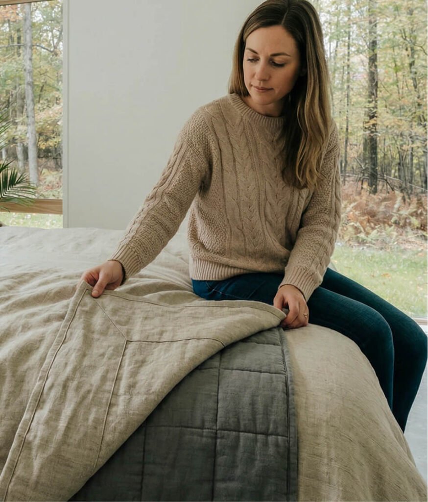 Woman with weighted linen duvet cover